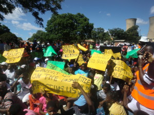 holding placards high